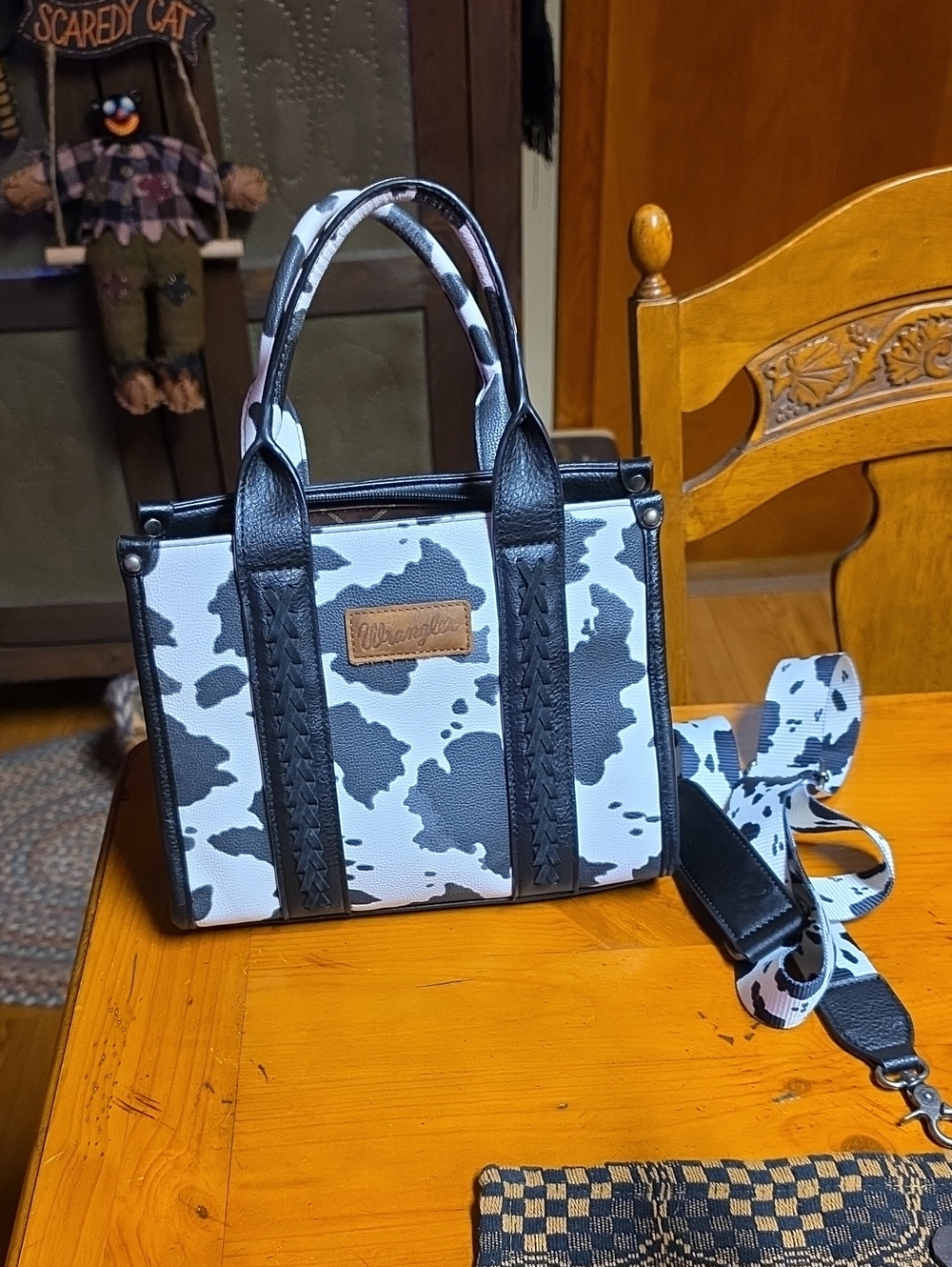 Wrangler  Black and White Cowprint Concealed Carry Purse with Crossbody Strap